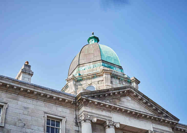 A view of the dome on a Law Society of Ireland building from ground level.